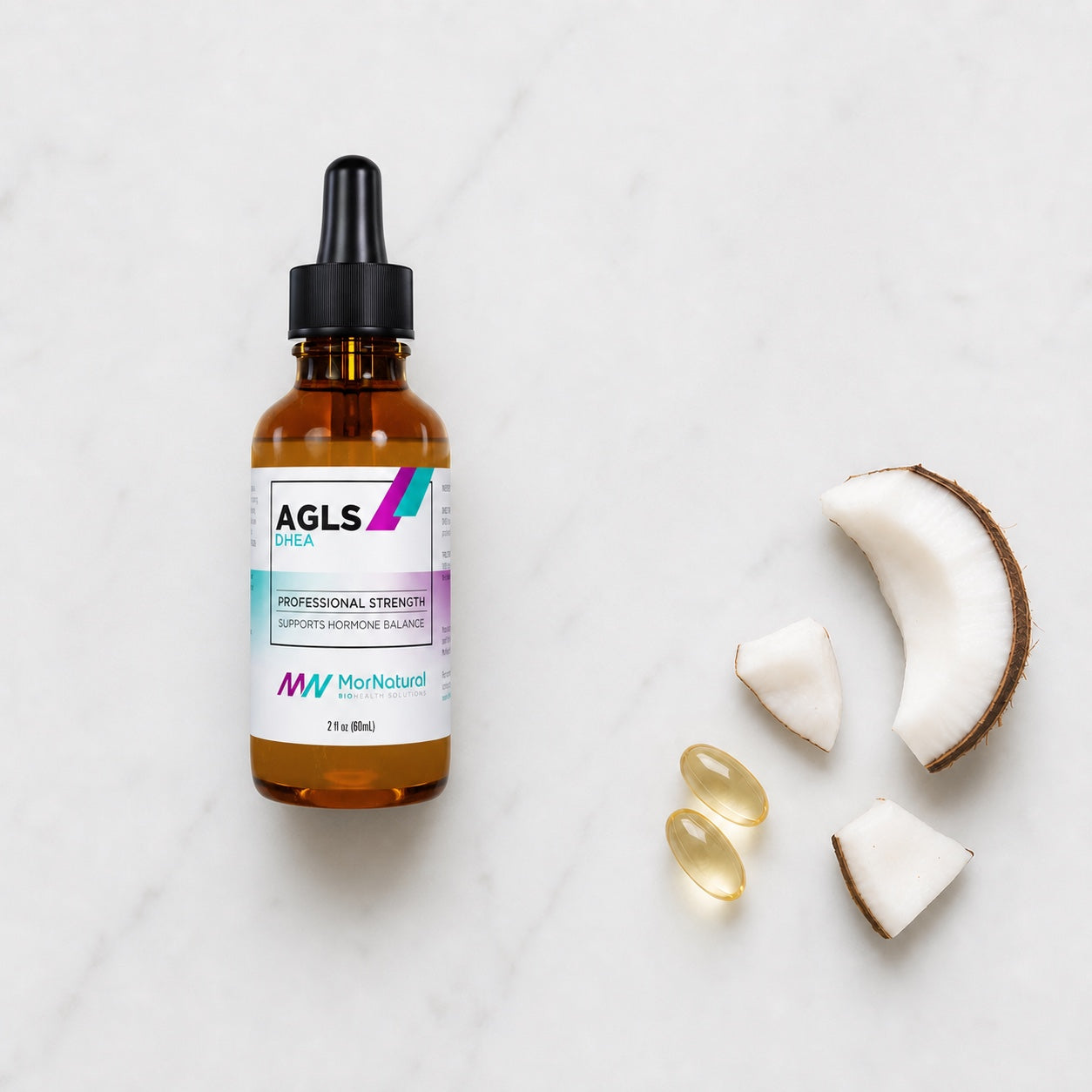 AGLS DHEA Oil bottle with dropper, coconut, and vitamin E softgels on white marble